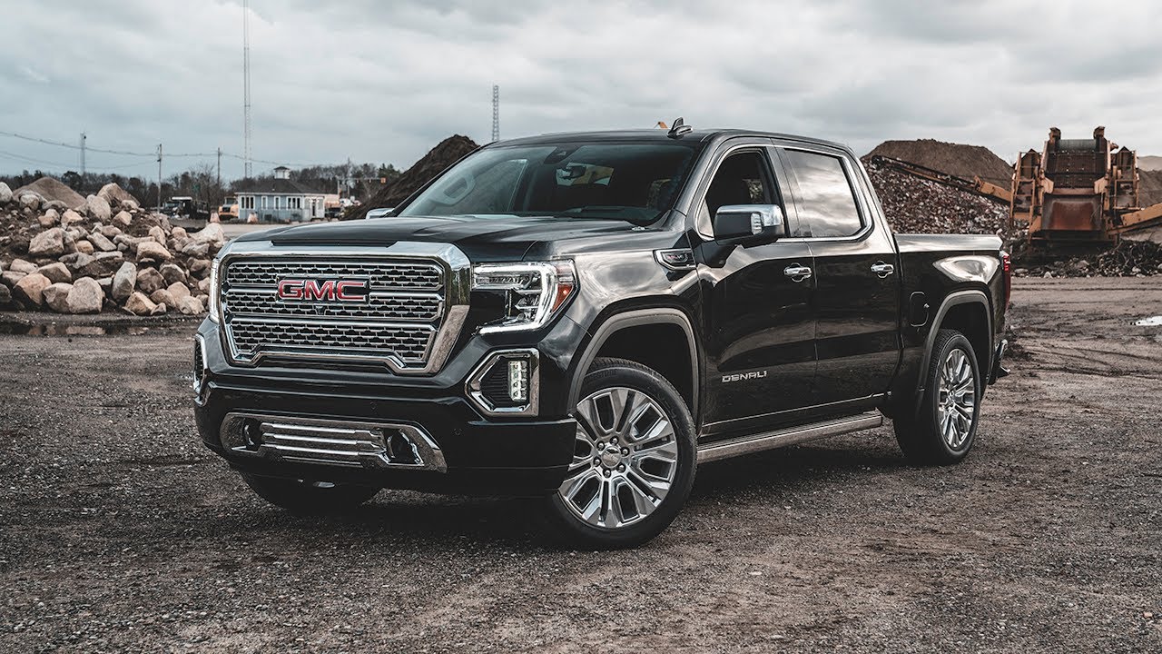 What could be causing excessive road noise in a 2016 GMC Sierra 1500, and how can it be minimized?